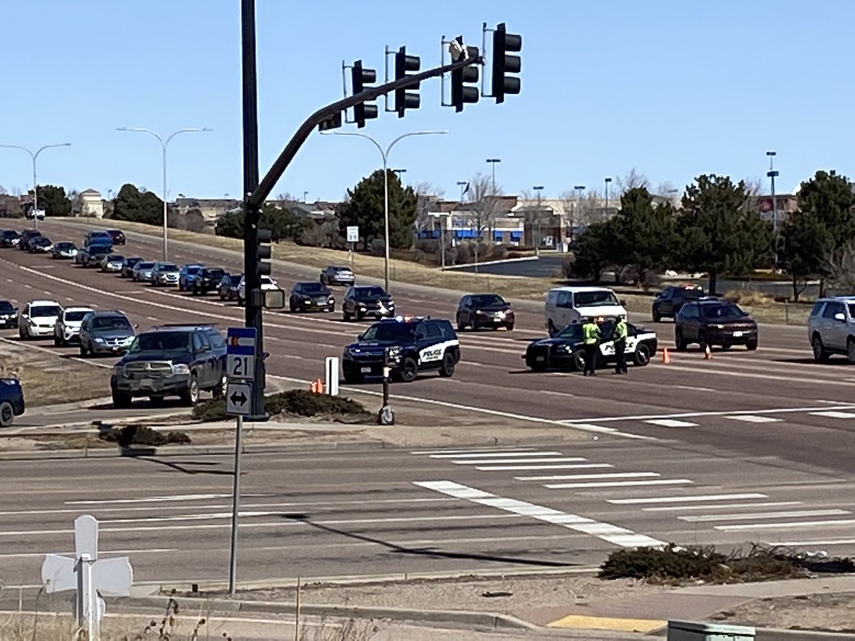 Colorado Springs Police say a person traveling through the intersection failed to yield the right-of-way to the emergency vehicle. This caused a collision in the intersection. The officer was transported to a local hospital for non-life-threatening injuries