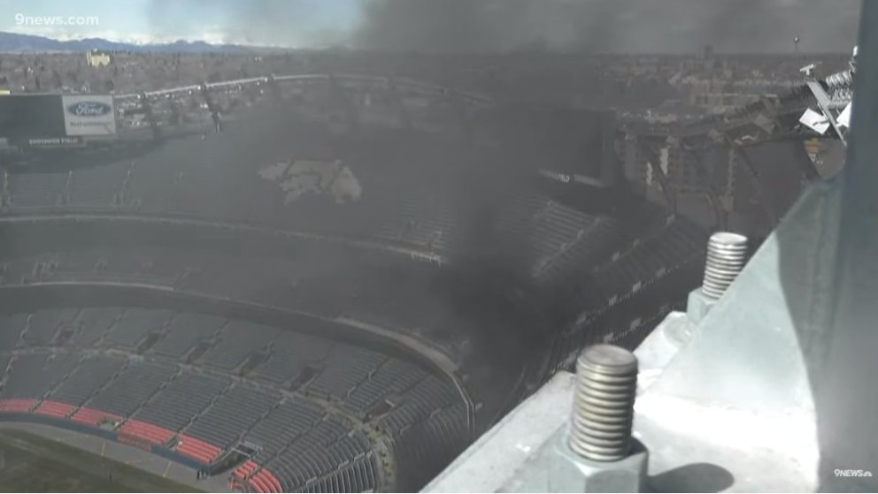 Plume of smoke visible from inside of Empower Field at Mile High in Denver