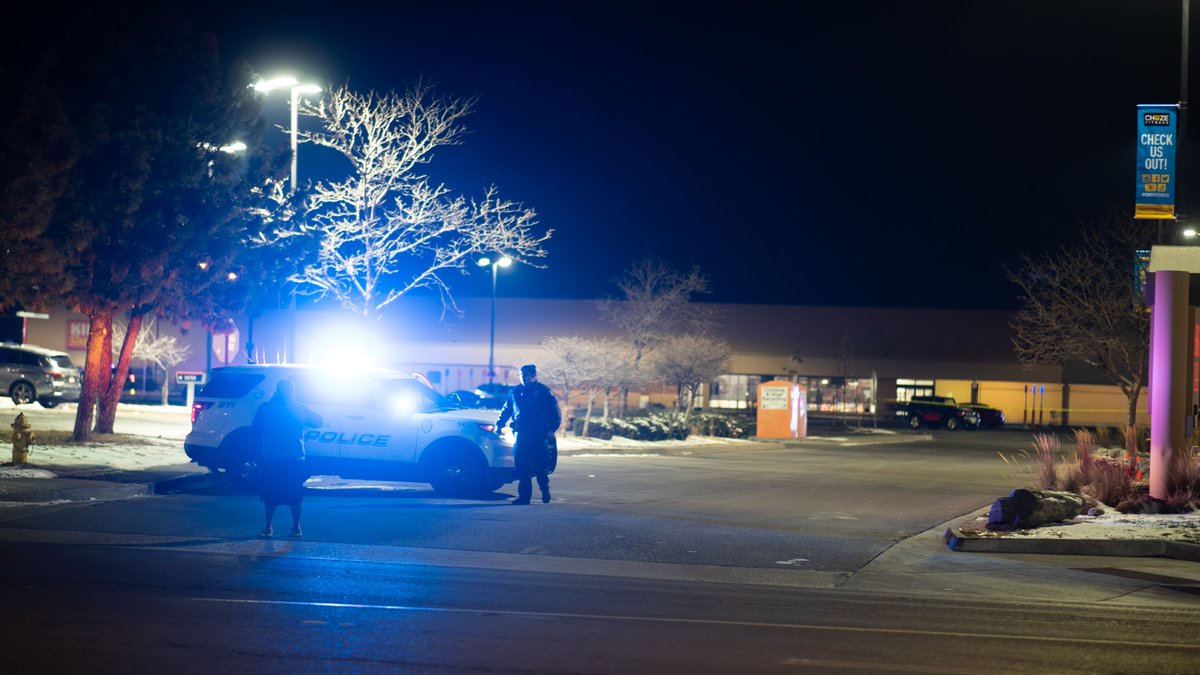 Large police presence in Aurora Plaza parking lot & surrounding area after officer-involved shooting. Police  currently searching for suspect who is believed to be armed. Aurora Police have issued a shelter-in-place for the area which is still active as of this tweet