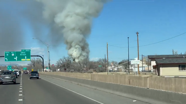 Crews are battling a building fire on West 29th Street, east of I-25, and are asking people to avoid the area
