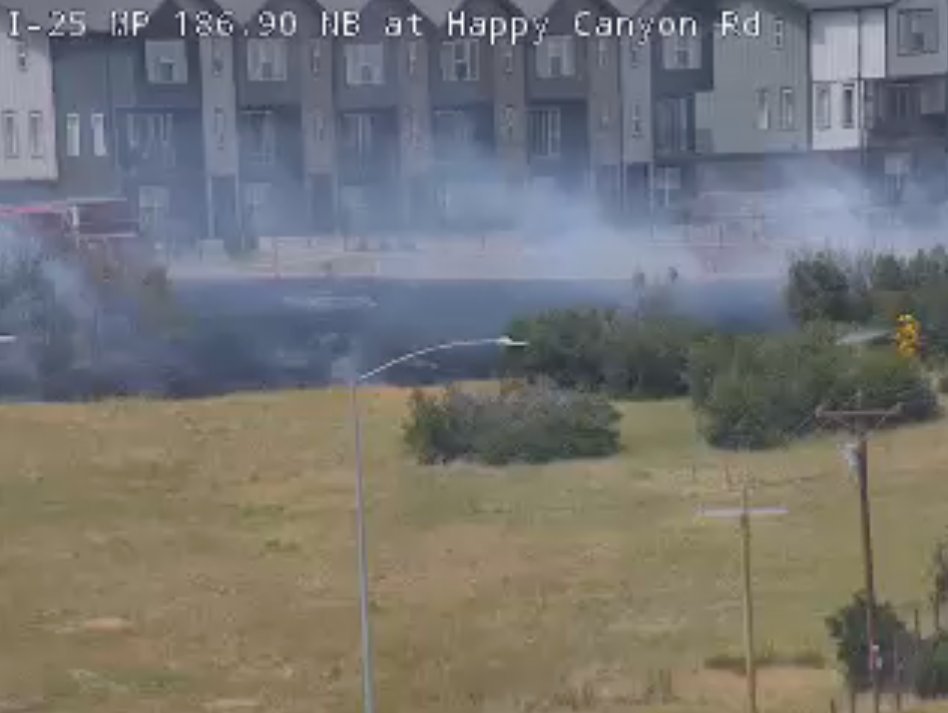 Firefighters on scene of vegetation fire near I-25 in Castle Pines